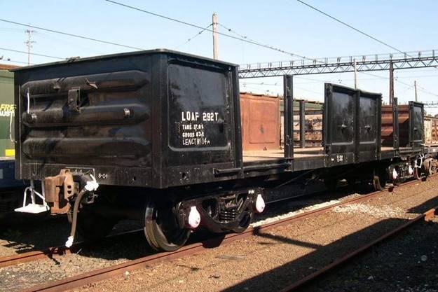 A large long train on a steel track

Description automatically generated