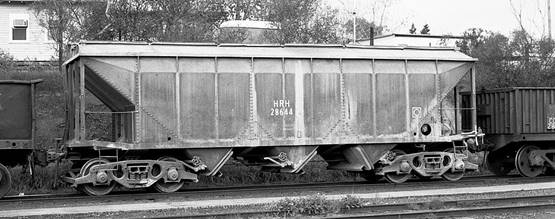 A large long train on a steel track

Description automatically generated