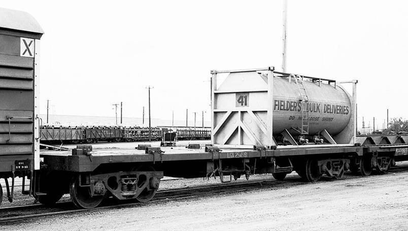 A black and white photo of a truck

Description automatically generated