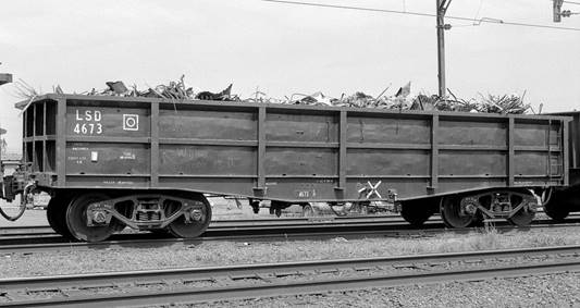 A truck that is sitting on a train track

Description automatically generated