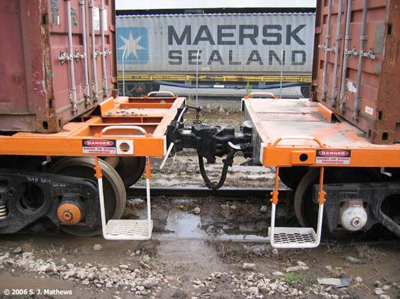 A picture containing outdoor, building, orange, truck

Description automatically generated