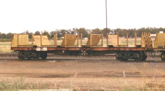 A truck traveling down a dirt road

Description automatically generated